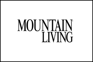 The image shows the words MOUNTAIN LIVING in bold, uppercase serif font, centered on a plain white background.