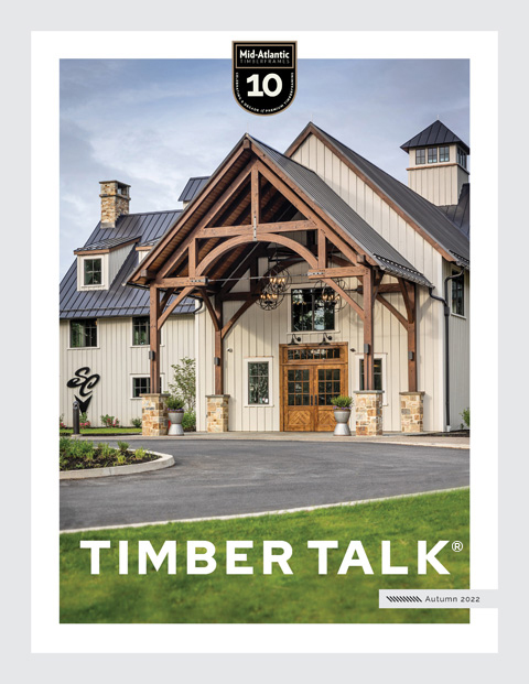 Cover of Timber Talk magazine showing a modern farmhouse with timber framing, stone accents, and metal roof; lush green lawn and landscaped plants in front. Text includes Autumn 2022 and a 10 years badge at the top.