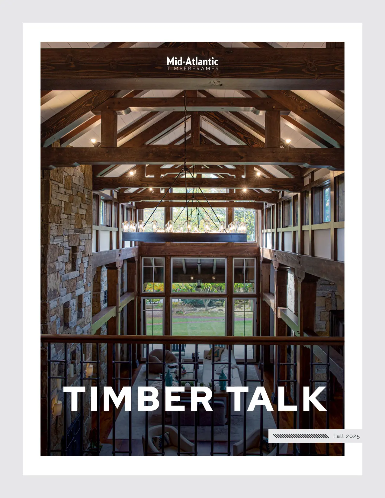 Cover of “Timber Talk” magazine featuring an open, rustic timber-framed interior with exposed beams, stone walls, large windows, and natural light. Header reads Mid-Atlantic Timberframes. Issue is Fall 2025.